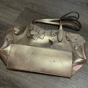 Women’s gold toned shoulder bag
